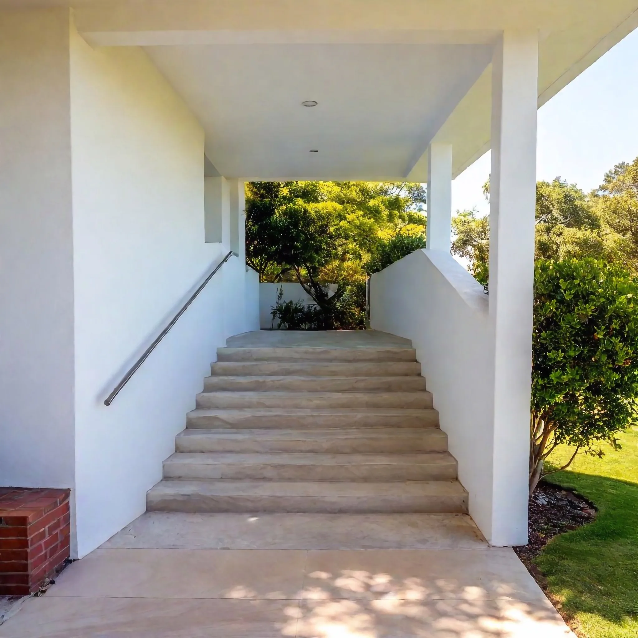 Concrete steps leading up to a home entrance