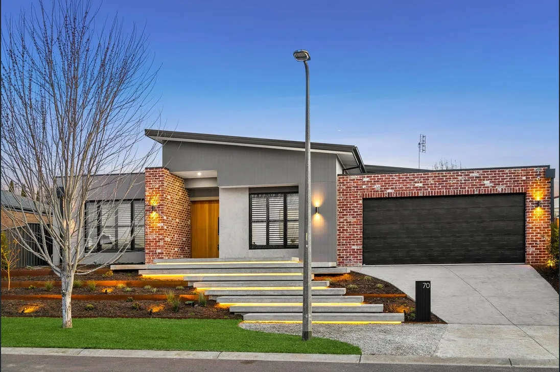 Concrete driveway with established landscaping
