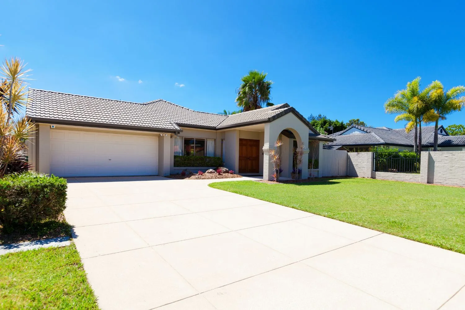 Newly poured concrete driveway outside a Pakenham home