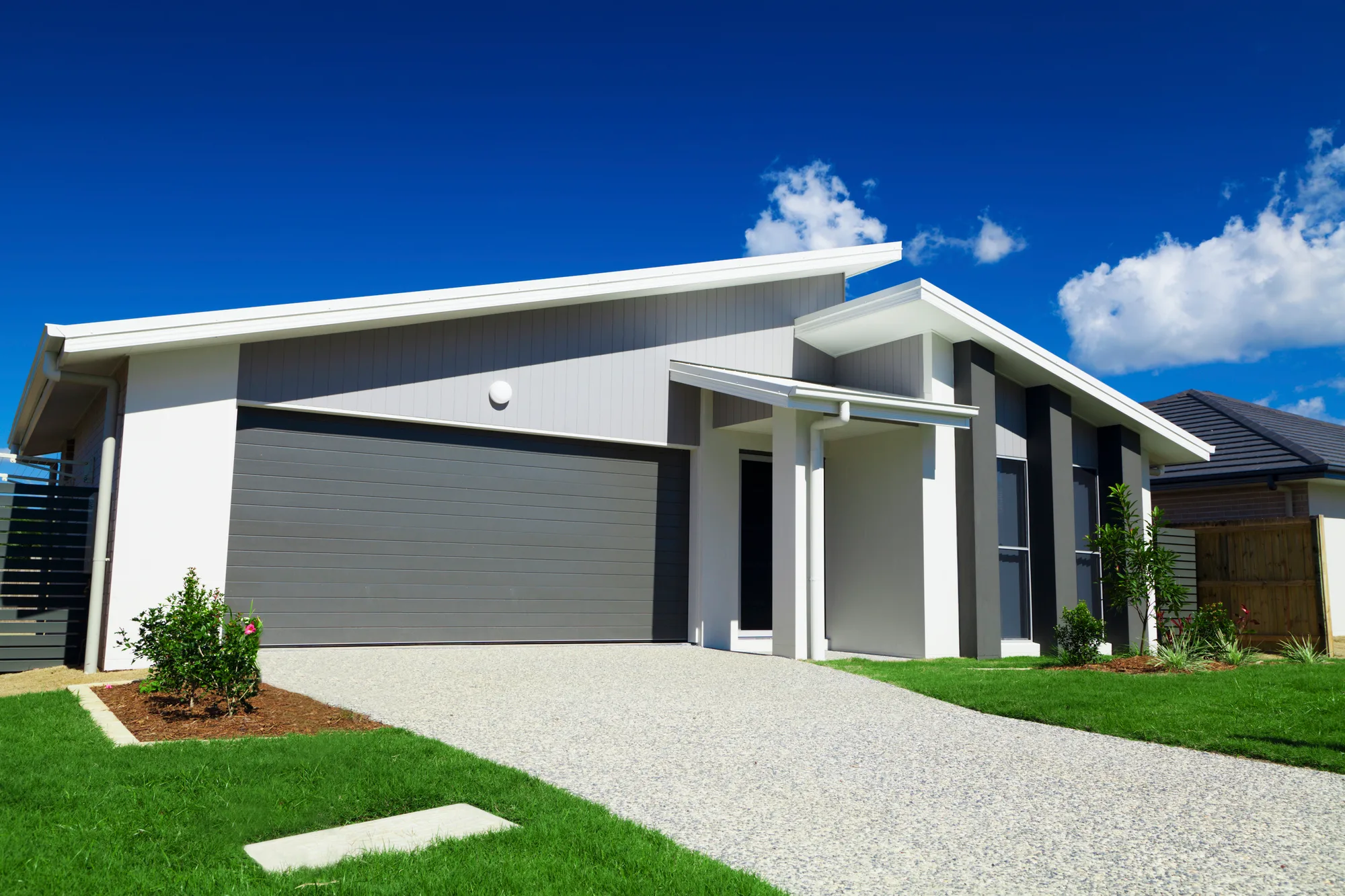 Exposed aggregate driveway with a textured natural stone finish