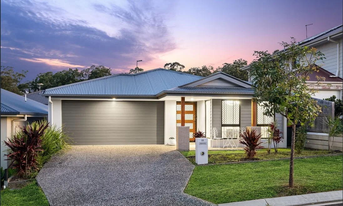Exposed aggregate driveway outside a modern home