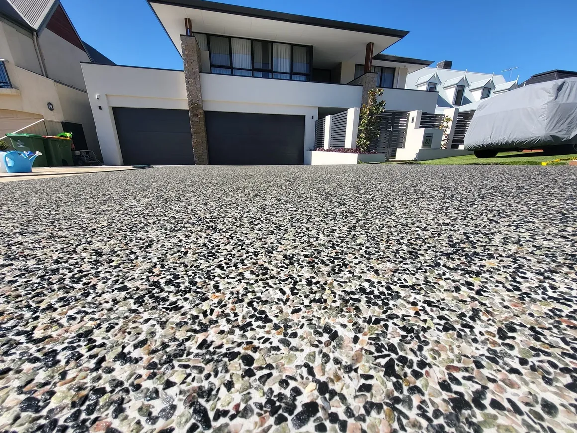 Close-up of a textured exposed aggregate concrete surface