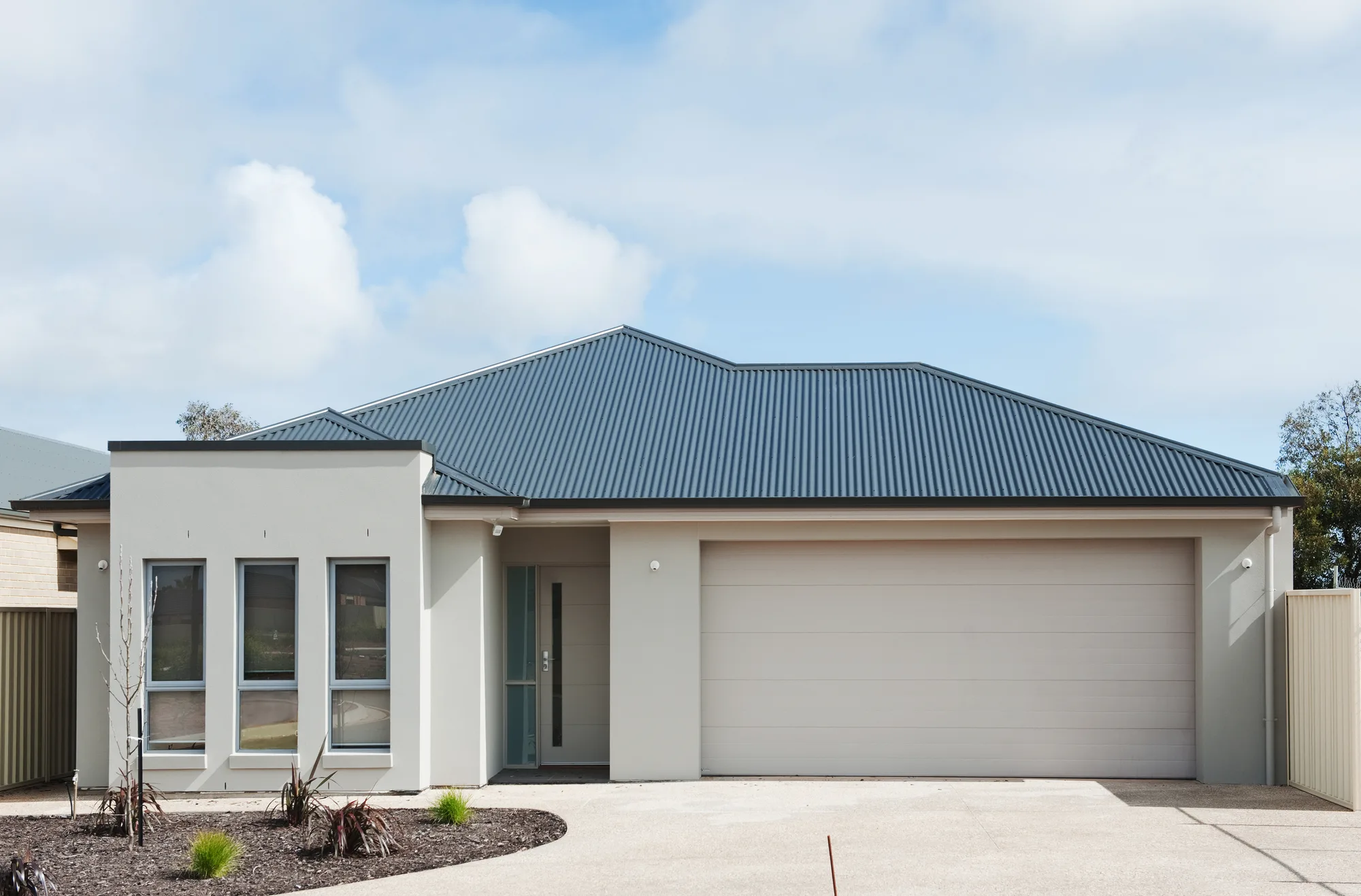 Plain finish concrete driveway outside a Beaconsfield home